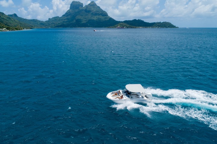 a body of water with a mountain in the background