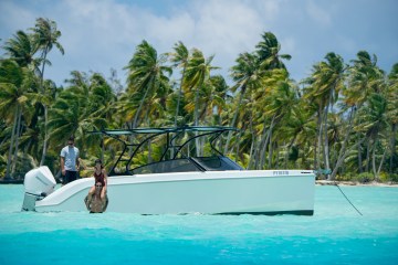 a group of people in a boat on a body of water