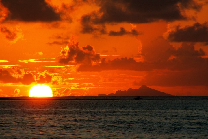 a sunset over a body of water